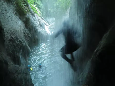 Jumping through a waterfall, Ecouges complete course, near Grenoble and Lyon, Vercors range